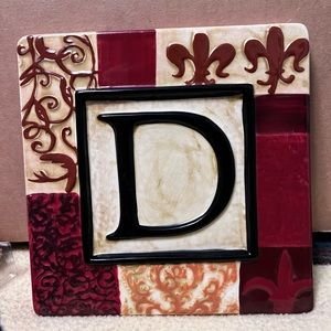 Kirkland’s Monogram ceramic wall plaque. D. 7 ½” x 7 ½”. Never used.